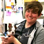 Dr. Shultz holding a puppy